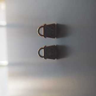 Par de pendientes en forma de bolso mini color cobre