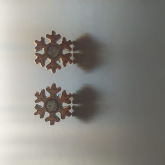 Pendientes en forma de copo de nieve dorado con circonita